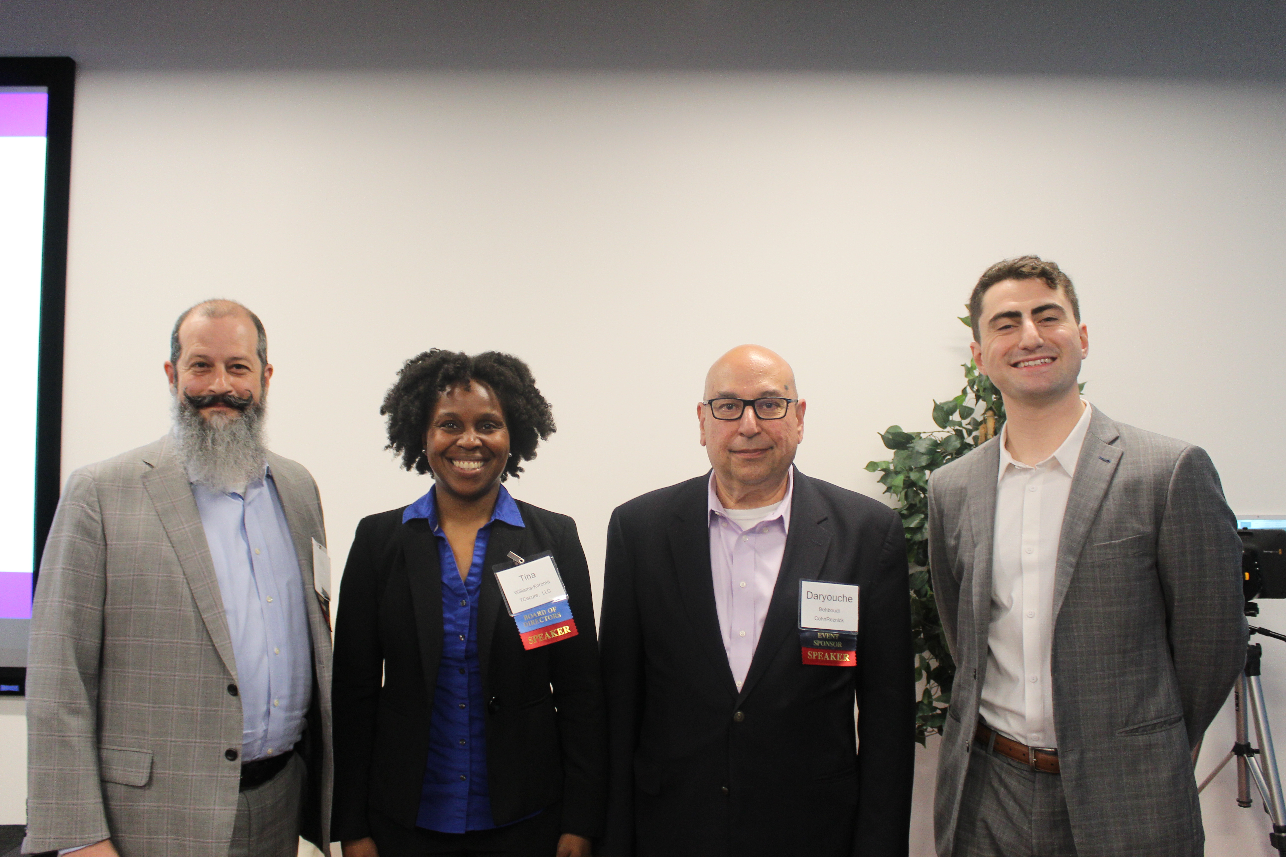 Cybersecurity professionals and government contractors networking at the 2025 CMMC Summit, discussing CMMC 2.0 compliance, assessment readiness, and controlled unclassified information (CUI) protection.